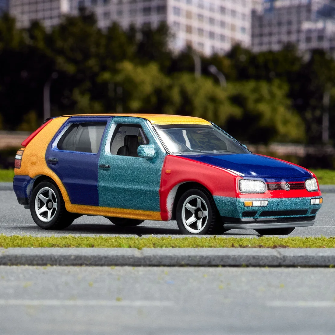 Matchbox Collectors 1995 Volkswagen Golf Harlequin diecast with multi-colour panels